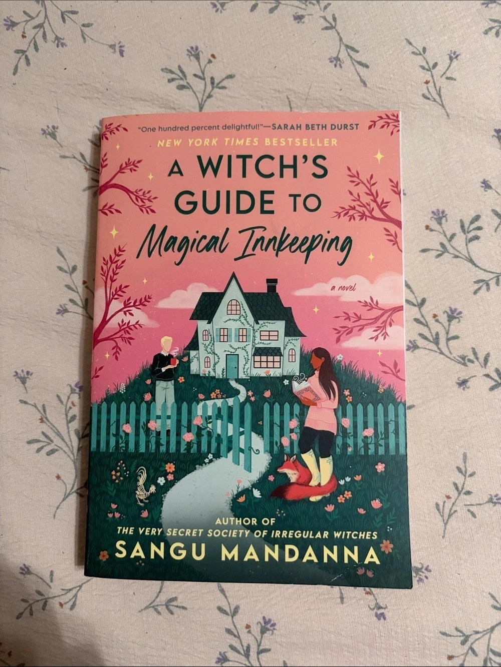 A Witch's Guide to Magical Innkeeping Paperback Book Pink & Green